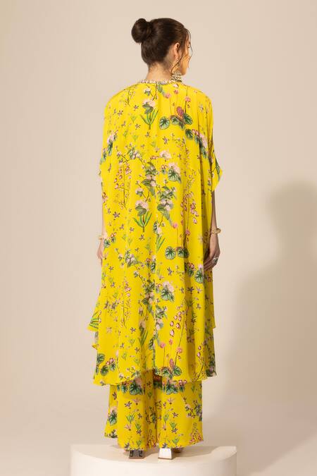 Shop SAKSHI GIRRI Yellow Crepe Sequins Botanical Print Cape And Bell Bottom Pant Set at Aza Fashions Shop_SAKSHI GIRRI_Yellow Crepe Sequins Botanical Print Cape And Bell Bottom Pant Set_at_Aza_Fashions