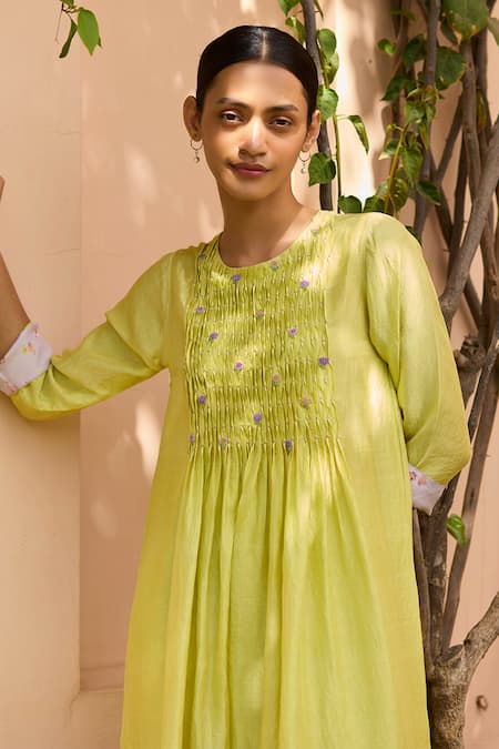 Shop Surmaye Green Handloom Cotton, Silk Blossom Embellished Smocked Yoke Kurta With Pant Online at Aza Fashions Shop_Surmaye_Green Handloom Cotton, Silk Blossom Embellished Smocked Yoke Kurta With Pant _Online_at_Aza_Fashions