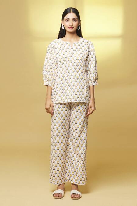 Kalakaari By Sagarika White Cotton Embroidery Button-down Neck Floral Print Top And Pant Set at Aza Fashions Kalakaari By Sagarika_White Cotton Embroidery Button-down Neck Floral Print Top And Pant Set _at_Aza_Fashions