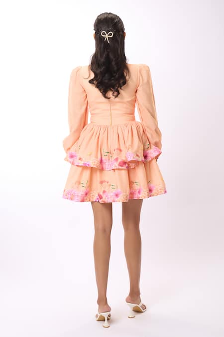 Shop Verano By Tanya Peach Linen Embroidery Plunge Neck Amelia Gardenia Print Tiered Short Dress at Aza Fashions Shop_Verano By Tanya_Peach Linen Embroidery Plunge Neck Amelia Gardenia Print Tiered Short Dress _at_Aza_Fashions