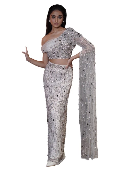 Shop Mehul Gupta Silver Net Sequins, Beads, Stones Asymmetric Hand Embroidered Blouse With Skirt Online at Aza Fashions Shop_Mehul Gupta_Silver Net Sequins, Beads, Stones Asymmetric Hand Embroidered Blouse With Skirt _Online_at_Aza_Fashions