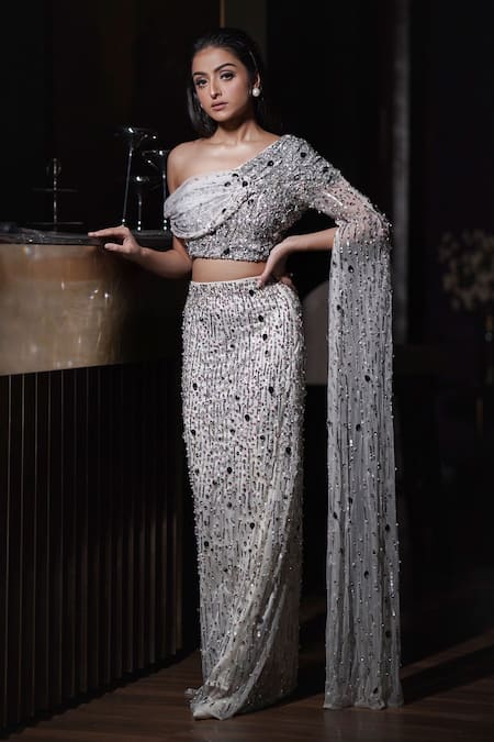 Mehul Gupta Silver Net Sequins, Beads, Stones Asymmetric Hand Embroidered Blouse With Skirt at Aza Fashions Mehul Gupta_Silver Net Sequins, Beads, Stones Asymmetric Hand Embroidered Blouse With Skirt _at_Aza_Fashions