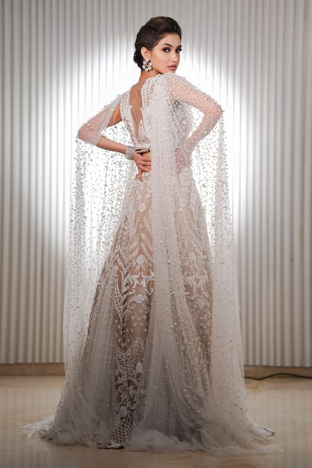 Shop Mehul Gupta Ivory Net Pearls, Cut Work Persian Garden Embroidered Bridal Cape Lehenga Set at Aza Fashions Shop_Mehul Gupta_Ivory Net Pearls, Cut Work Persian Garden Embroidered Bridal Cape Lehenga Set _at_Aza_Fashions