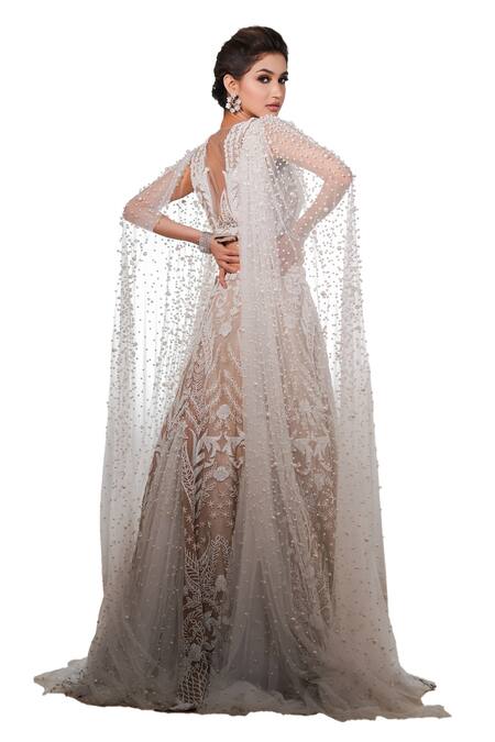 Mehul Gupta Ivory Net Pearls, Cut Work Persian Garden Embroidered Bridal Cape Lehenga Set at Aza Fashions Mehul Gupta_Ivory Net Pearls, Cut Work Persian Garden Embroidered Bridal Cape Lehenga Set _at_Aza_Fashions