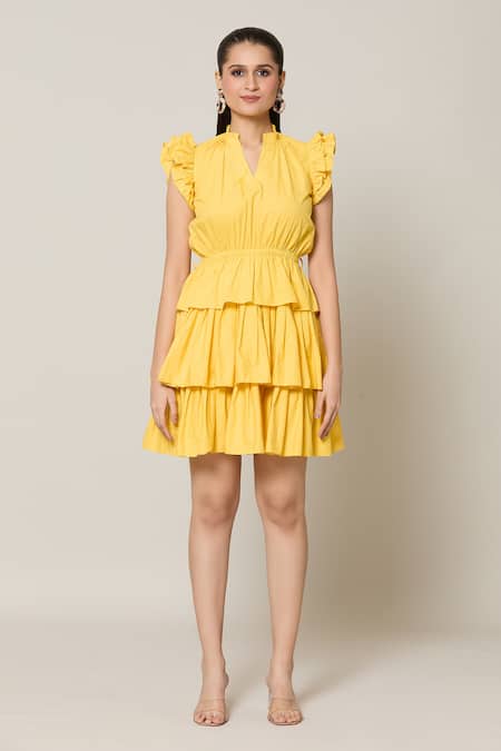 Naintara Bajaj Yellow Cotton V-neck Amalfi Solid Layered Short Dress at Aza Fashions Naintara Bajaj_Yellow Cotton V-neck Amalfi Solid Layered Short Dress _at_Aza_Fashions