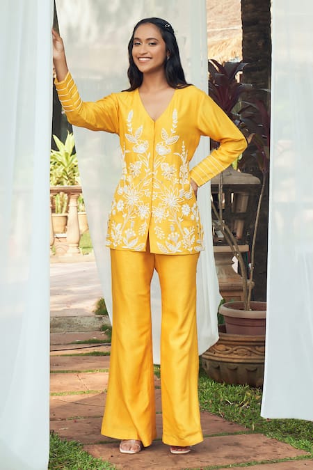 Megha Pitti_Yellow Silk Cut Work, Beads V-neck Cutdana Embroidered Top And Flared Pant Set _at_Aza_Fashions
