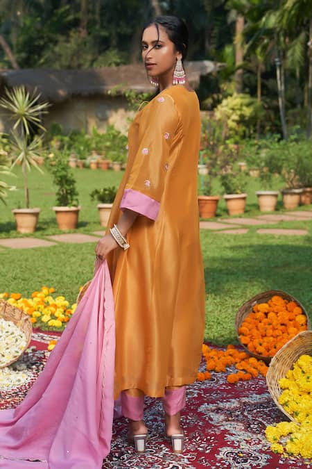 Shop_Megha Pitti_Yellow Organza, Tissue Tassels, Embroidery Keyhole Neck Floral Sleeve Kurta Set _at_Aza_Fashions