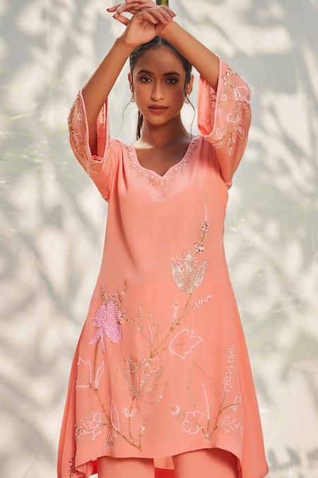 Megha Pitti Peach Crepe Sequins, Cut Work Open And Cutdana Embroidered Tunic & Flared Pant Set Online at Aza Fashions Megha Pitti_Peach Crepe Sequins, Cut Work Open And Cutdana Embroidered Tunic & Flared Pant Set _Online_at_Aza_Fashions