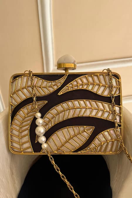 Shop Adwita Bags & Jewels Gold Mother Of Pearl Aaroohi Leaf Carved Clutch at Aza Fashions Shop_Adwita Bags & Jewels_Gold Mother Of Pearl Aaroohi Leaf Carved Clutch _at_Aza_Fashions