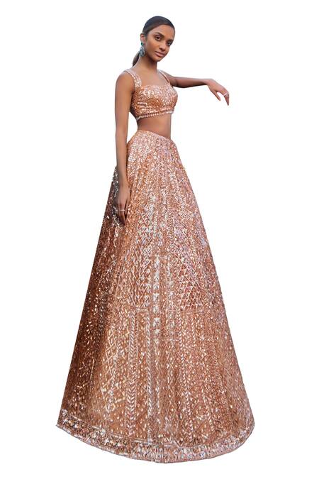 Seema Gujral_Peach Net Tassels, Sequins Sweetheart Neck Embroidered Bridal Lehenga Set _at_Aza_Fashions