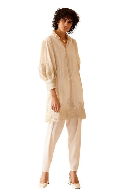 Bunka Ivory 100% Cotton Embellished Floral Lace Ruffle Slava Tunic Online at Aza Fashions Bunka_Ivory 100% Cotton Embellished Floral Lace Ruffle Slava Tunic _Online_at_Aza_Fashions
