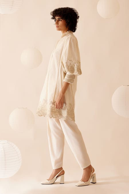 Buy Bunka Ivory 100% Cotton Embellished Floral Lace Ruffle Slava Tunic Online at Aza Fashions Buy_Bunka_Ivory 100% Cotton Embellished Floral Lace Ruffle Slava Tunic _Online_at_Aza_Fashions