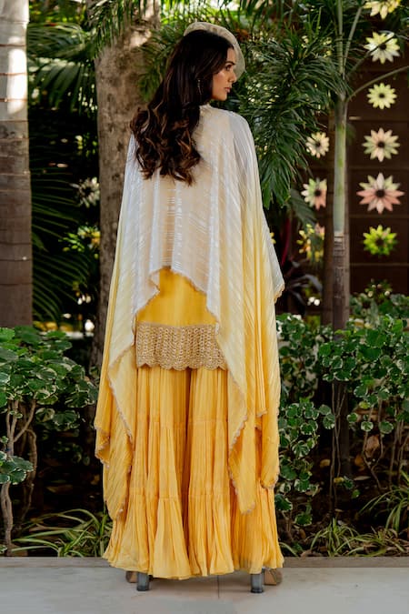 Shop Nikita Vishakha Yellow Silk, Lurex Beads, Tassels Round Neck Embroidered Cape Gharara Set at Aza Fashions Shop_Nikita Vishakha_Yellow Silk, Lurex Beads, Tassels Round Neck Embroidered Cape Gharara Set _at_Aza_Fashions