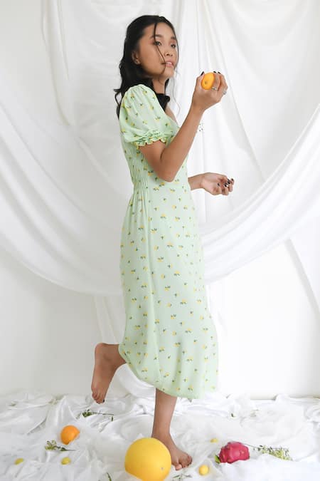 Shop Bohobi Green Cotton V-neck Melody Lime Print Slit Dress at Aza Fashions Shop_Bohobi_Green Cotton V-neck Melody Lime Print Slit Dress _at_Aza_Fashions