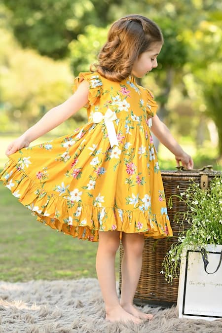 Shop The Pony & Peony Co. Yellow Rayon, Cotton Bows Poppy Blossom Print Dress at Aza Fashions Shop_The Pony & Peony Co._Yellow Rayon, Cotton Bows Poppy Blossom Print Dress _at_Aza_Fashions