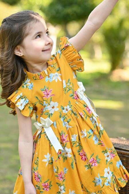 Shop The Pony & Peony Co. Yellow Rayon, Cotton Bows Poppy Blossom Print Dress Online at Aza Fashions Shop_The Pony & Peony Co._Yellow Rayon, Cotton Bows Poppy Blossom Print Dress _Online_at_Aza_Fashions