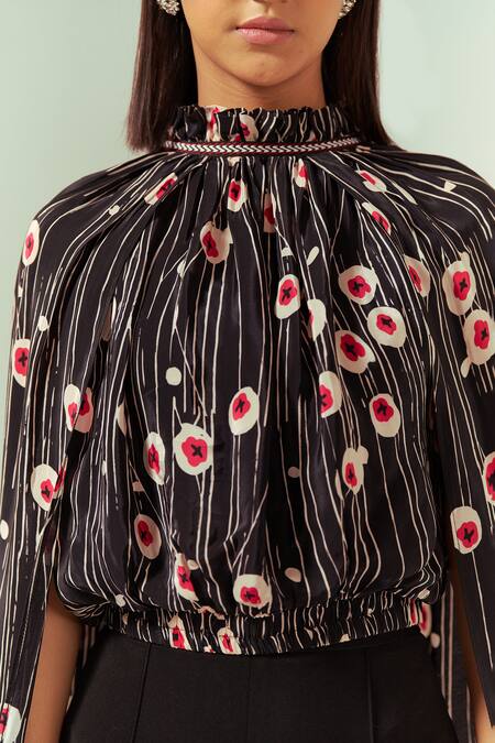 Shop Coeur Black Natural Crepe Print Sakura Halter Neck Wing Sleeves Top With Flared Pant Shop_Coeur_Black Natural Crepe Print Sakura Halter Neck Wing Sleeves Top With Flared Pant