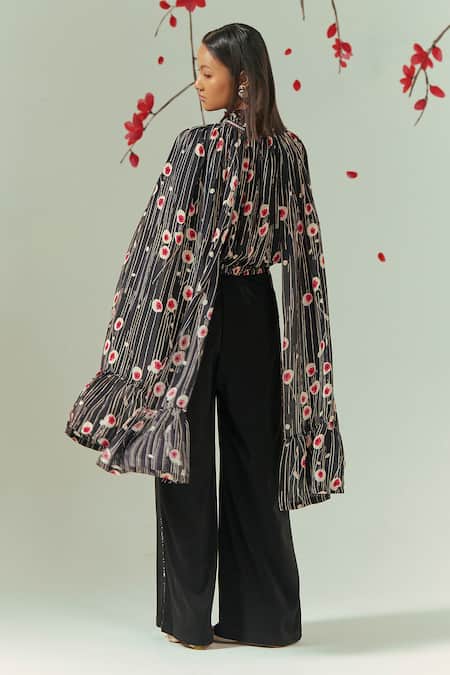 Shop Coeur Black Natural Crepe Print Sakura Halter Neck Wing Sleeves Top With Flared Pant at Aza Fashions Shop_Coeur_Black Natural Crepe Print Sakura Halter Neck Wing Sleeves Top With Flared Pant _at_Aza_Fashions