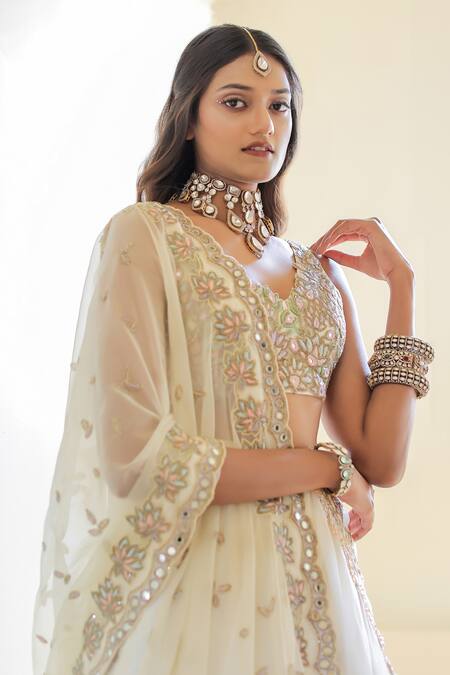 Foram Patel_Cream Organza, Net Mirrors, Embroidery V-neck Blouse Flared Lehenga Set_at_Aza_Fashions