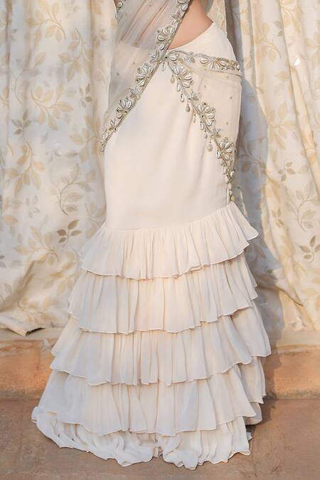 Foram Patel_Cream Net, Georgette, Border Work Ruffle Pre-draped Skirt Saree With Blouse_Online_at_Aza_Fashions
