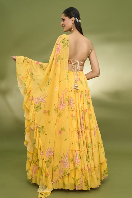 Shop Foram Patel Yellow Georgette, Net Embroidery, Mirrors V-neck Printed Tiered Lehenga Set at Aza Fashions Shop_Foram Patel_Yellow Georgette, Net Embroidery, Mirrors V-neck Printed Tiered Lehenga Set_at_Aza_Fashions