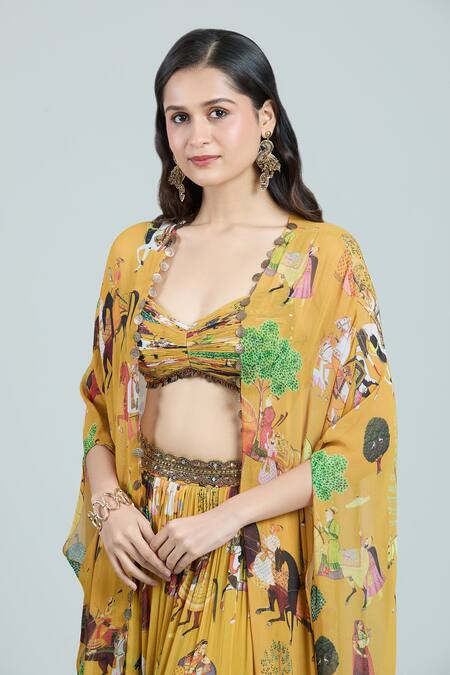 Rajat K Tangri Yellow Chiffon, Cotton Tassels Sweetheart Neck Mughal Art Print Cape Lehenga Set at Aza Fashions Rajat K Tangri_Yellow Chiffon, Cotton Tassels Sweetheart Neck Mughal Art Print Cape Lehenga Set _at_Aza_Fashions