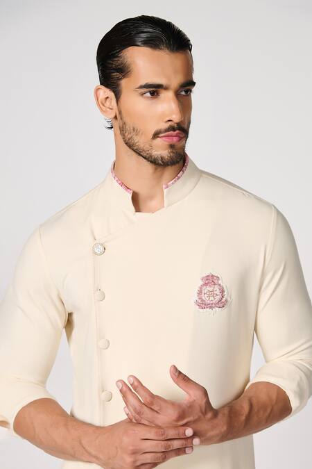 Buy S&N By Shantnu Nikhil Off White Embroidery Crest Asymmetric Kurta Online at Aza Fashions Buy_S&N By Shantnu Nikhil_Off White Embroidery Crest Asymmetric Kurta_Online_at_Aza_Fashions