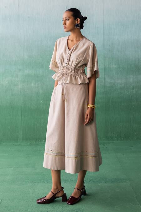 Shop Archana Jaju Beige Cotton, Chanderi Beads V-neck Threadwork Peplum Top With Flared Pant at Aza Fashions Shop_Archana Jaju_Beige Cotton, Chanderi Beads V-neck Threadwork Peplum Top With Flared Pant_at_Aza_Fashions