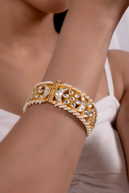 Shop Shlok Jewels White Stones, Beads Half Crescent Carved Bangles - Set Of 2 at Aza Fashions Shop_Shlok Jewels_White Stones, Beads Half Crescent Carved Bangles - Set Of 2 _at_Aza_Fashions