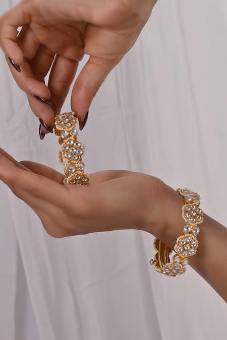 Shop Shlok Jewels White Stones, Beads Floral Carved Bangles - Set Of 2 at Aza Fashions Shop_Shlok Jewels_White Stones, Beads Floral Carved Bangles - Set Of 2 _at_Aza_Fashions