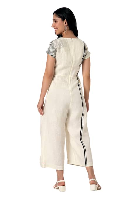 Kaveri_Off White Linen V-neck Brick Placement Print Jumpsuit_at_Aza_Fashions