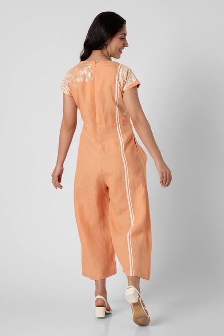 Shop Kaveri Orange Linen V-neck Brick Placement Print Jumpsuit at Aza Fashions Shop_Kaveri_Orange Linen V-neck Brick Placement Print Jumpsuit_at_Aza_Fashions