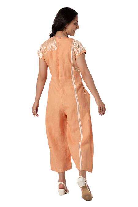 Kaveri Orange Linen V-neck Brick Placement Print Jumpsuit at Aza Fashions Kaveri_Orange Linen V-neck Brick Placement Print Jumpsuit_at_Aza_Fashions