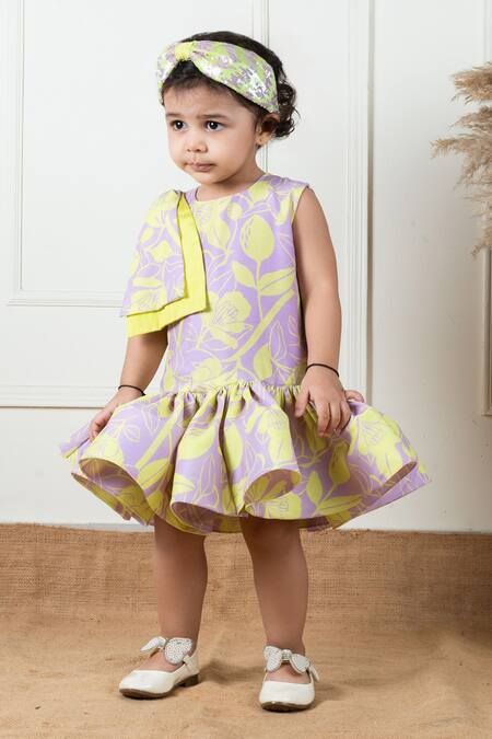 Lil Angels Purple Muslin, Cotton Ruffles, Bows Floral Pattern Short Dress at Aza Fashions Lil Angels_Purple Muslin, Cotton Ruffles, Bows Floral Pattern Short Dress _at_Aza_Fashions