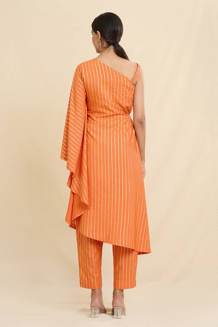 Shop Naintara Bajaj Orange Crepe Asymmetric Stripe Pattern Kurta And Trouser Set at Aza Fashions Shop_Naintara Bajaj_Orange Crepe Asymmetric Stripe Pattern Kurta And Trouser Set_at_Aza_Fashions