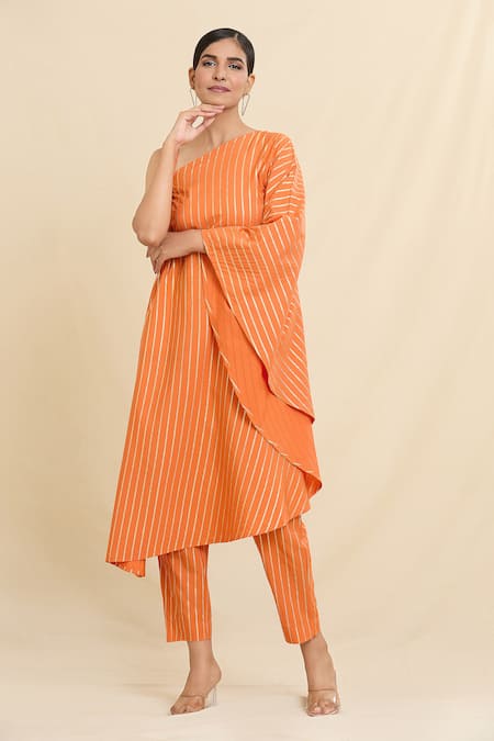 Shop Naintara Bajaj Orange Crepe Asymmetric Stripe Pattern Kurta And Trouser Set Online at Aza Fashions Shop_Naintara Bajaj_Orange Crepe Asymmetric Stripe Pattern Kurta And Trouser Set_Online_at_Aza_Fashions