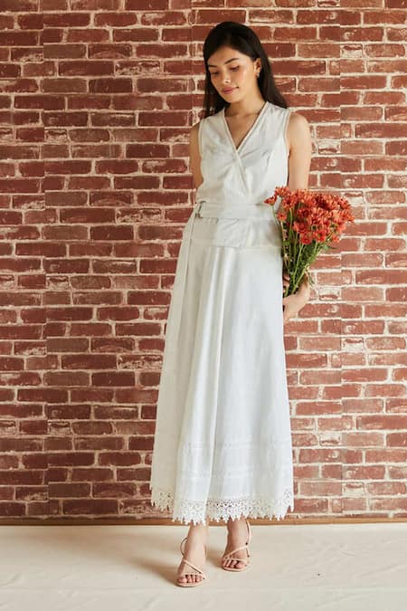 Shop Shruti Sancheti White Cotton Lace, Buckles V-neck Embellished Top Skirt Set at Aza Fashions Shop_Shruti Sancheti_White Cotton Lace, Buckles V-neck Embellished Top Skirt Set _at_Aza_Fashions