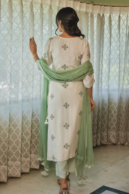 Shop Kapraaaha Ivory Muslin Embroidery Round Neck Straight Kurta And Pant Set at Aza Fashions Shop_Kapraaaha_Ivory Muslin Embroidery Round Neck Straight Kurta And Pant Set_at_Aza_Fashions