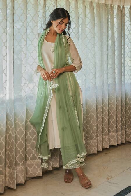Kapraaaha Ivory Muslin Embroidery Round Neck Straight Kurta And Pant Set at Aza Fashions Kapraaaha_Ivory Muslin Embroidery Round Neck Straight Kurta And Pant Set_at_Aza_Fashions