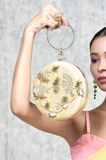 The Tan Clan Gold Sequin Rashida Circular Embroidered Clutch at Aza Fashions The Tan Clan_Gold Sequin Rashida Circular Embroidered Clutch _at_Aza_Fashions