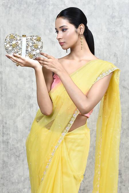 The Tan Clan_Gold Mother Of Pearl Seher Heart Shaped Embellished Clutch _at_Aza_Fashions