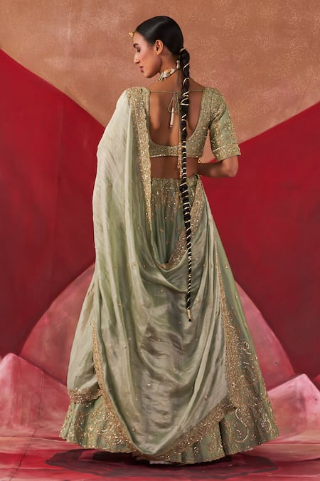 Shop Jigar Mali Green Brocade, Organza Embroidery, Sequins Asymmetric Dori Blouse Lehenga Set at Aza Fashions Shop_Jigar Mali_Green Brocade, Organza Embroidery, Sequins Asymmetric Dori Blouse Lehenga Set _at_Aza_Fashions