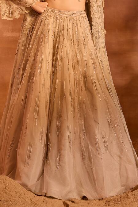 Buy Divya Aggarwal Beige Metallic Chanderi Embellished Tassel Blouse V Idalia Cape And Lehenga Set Online at Aza Fashions Buy_Divya Aggarwal_Beige Metallic Chanderi Embellished Tassel Blouse V Idalia Cape And Lehenga Set _Online_at_Aza_Fashions