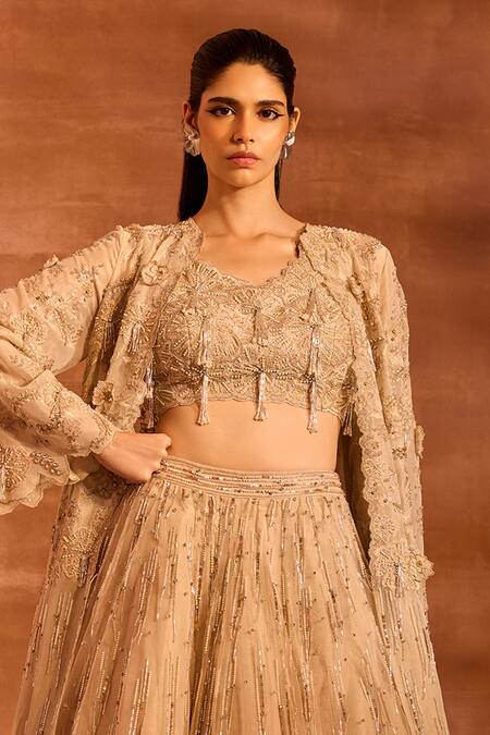 Shop Divya Aggarwal Beige Metallic Chanderi Embellished Tassel Blouse V Idalia Cape And Lehenga Set Online at Aza Fashions Shop_Divya Aggarwal_Beige Metallic Chanderi Embellished Tassel Blouse V Idalia Cape And Lehenga Set _Online_at_Aza_Fashions