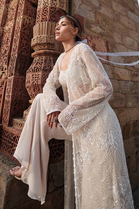 Shop Kashmiraa Ivory Cotton, Georgette Beads, Sequins Floral Embroidered Cape Sharara Set Online at Aza Fashions Shop_Kashmiraa_Ivory Cotton, Georgette Beads, Sequins Floral Embroidered Cape Sharara Set _Online_at_Aza_Fashions