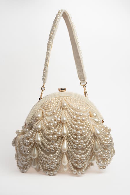 Nayaab By Sonia Off White Pearls Oyster Frame Snowflake Embellished Potli Clutch Online at Aza Fashions Nayaab By Sonia_Off White Pearls Oyster Frame Snowflake Embellished Potli Clutch _Online_at_Aza_Fashions