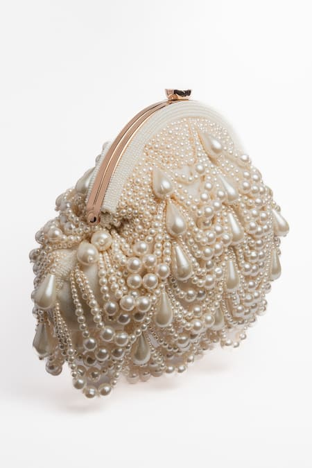Shop Nayaab By Sonia Off White Pearls Oyster Frame Snowflake Embellished Potli Clutch Online at Aza Fashions Shop_Nayaab By Sonia_Off White Pearls Oyster Frame Snowflake Embellished Potli Clutch _Online_at_Aza_Fashions