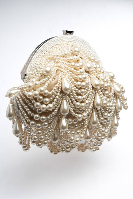 Nayaab By Sonia Off White Pearls Oyster Frame Snowflake Embellished Potli Clutch at Aza Fashions Nayaab By Sonia_Off White Pearls Oyster Frame Snowflake Embellished Potli Clutch _at_Aza_Fashions