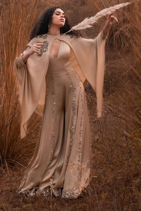 Kaprapan By Anaita Shah_Beige Satin Chiffon Embroidered Sequin Round Jumpsuit With Cape_at_Aza_Fashions
