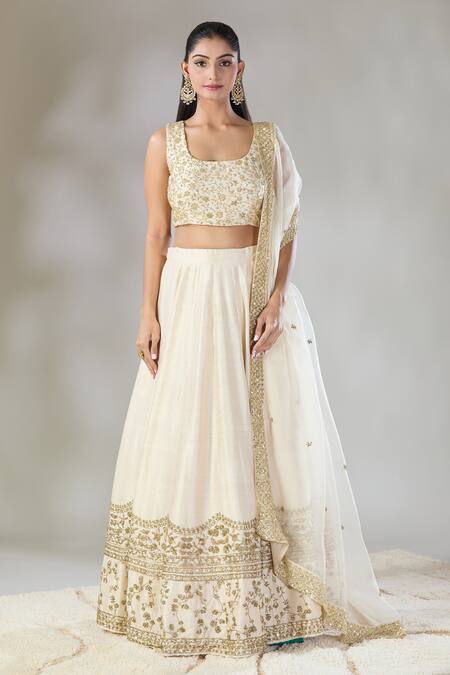 Astha Narang Off White Silk Embroidery, Cut Work, Sequins Round Neck Raw Border Lehenga Set at Aza Fashions Astha Narang_Off White Silk Embroidery, Cut Work, Sequins Round Neck Raw Border Lehenga Set _at_Aza_Fashions